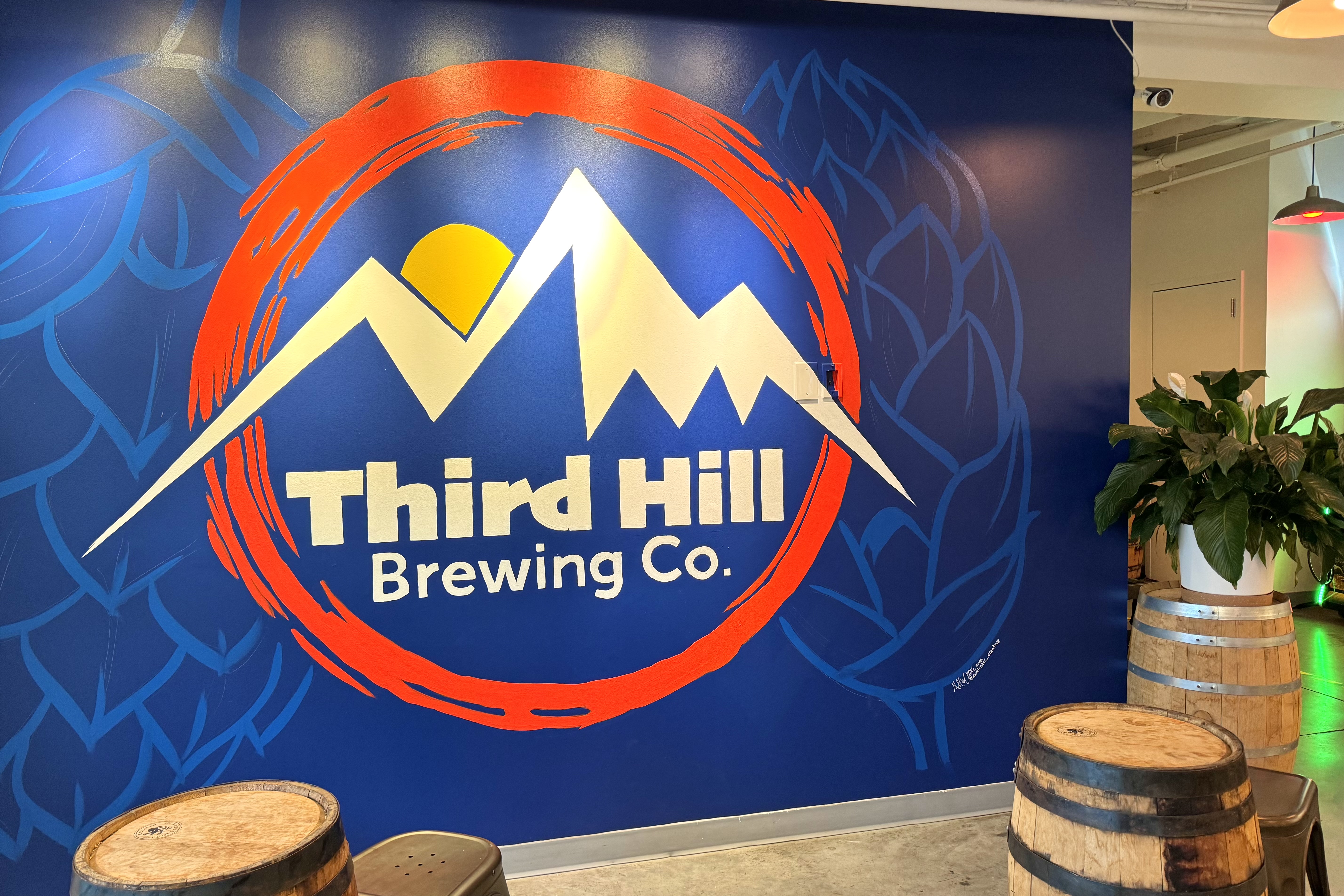 Wall art at Third Hill Brewing Co. of the business's logo